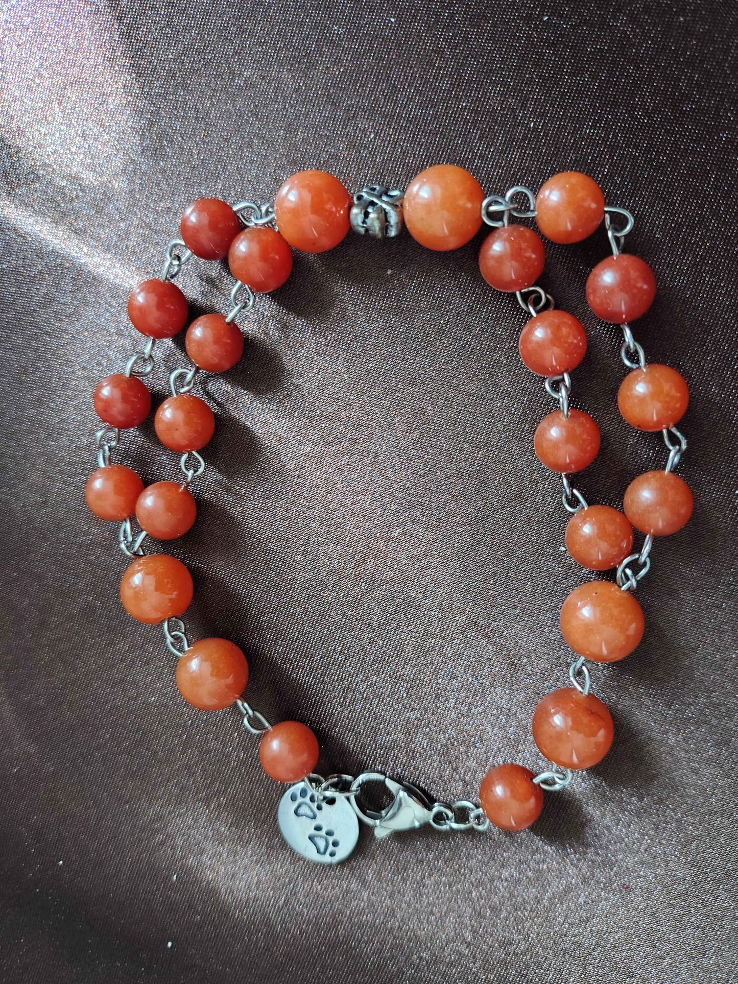 Bracciale in avventurina arancione con nodo centrale